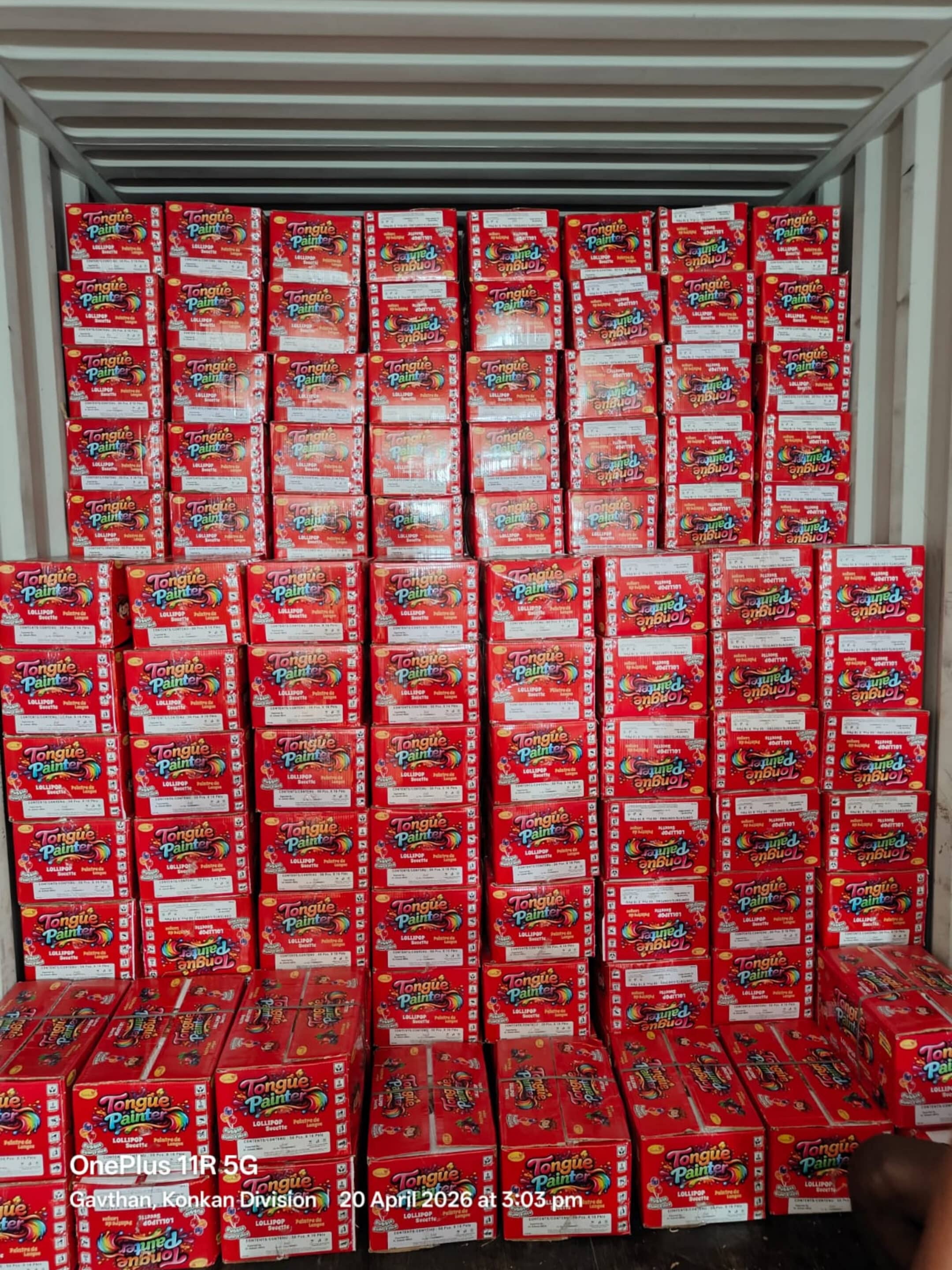Stack of red Tongue Painter lollipop boxes neatly arranged in a large display bin/box with multiple rows and columns